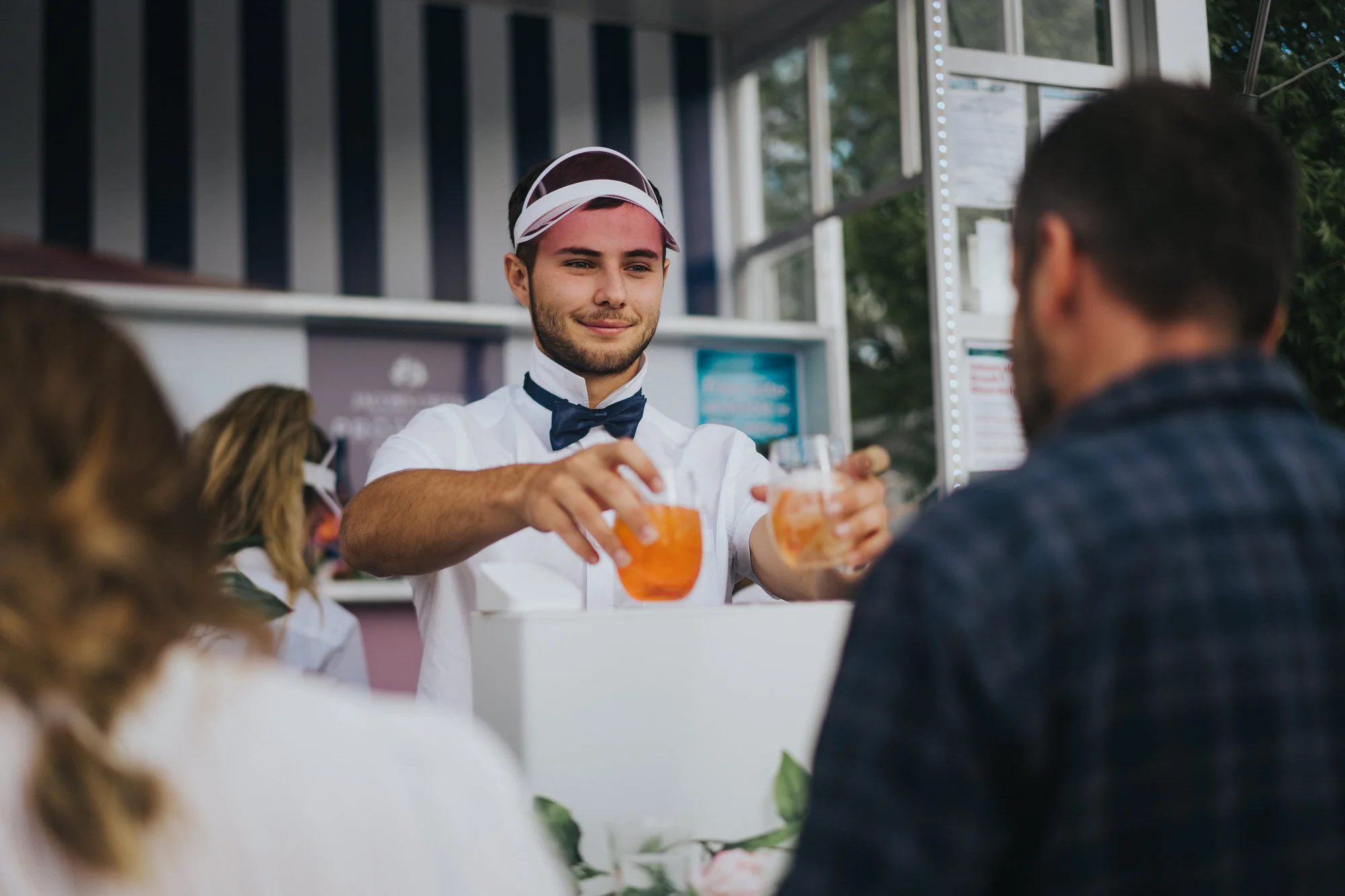 Bartender serving cocktails at a brand activation event in Sydney.