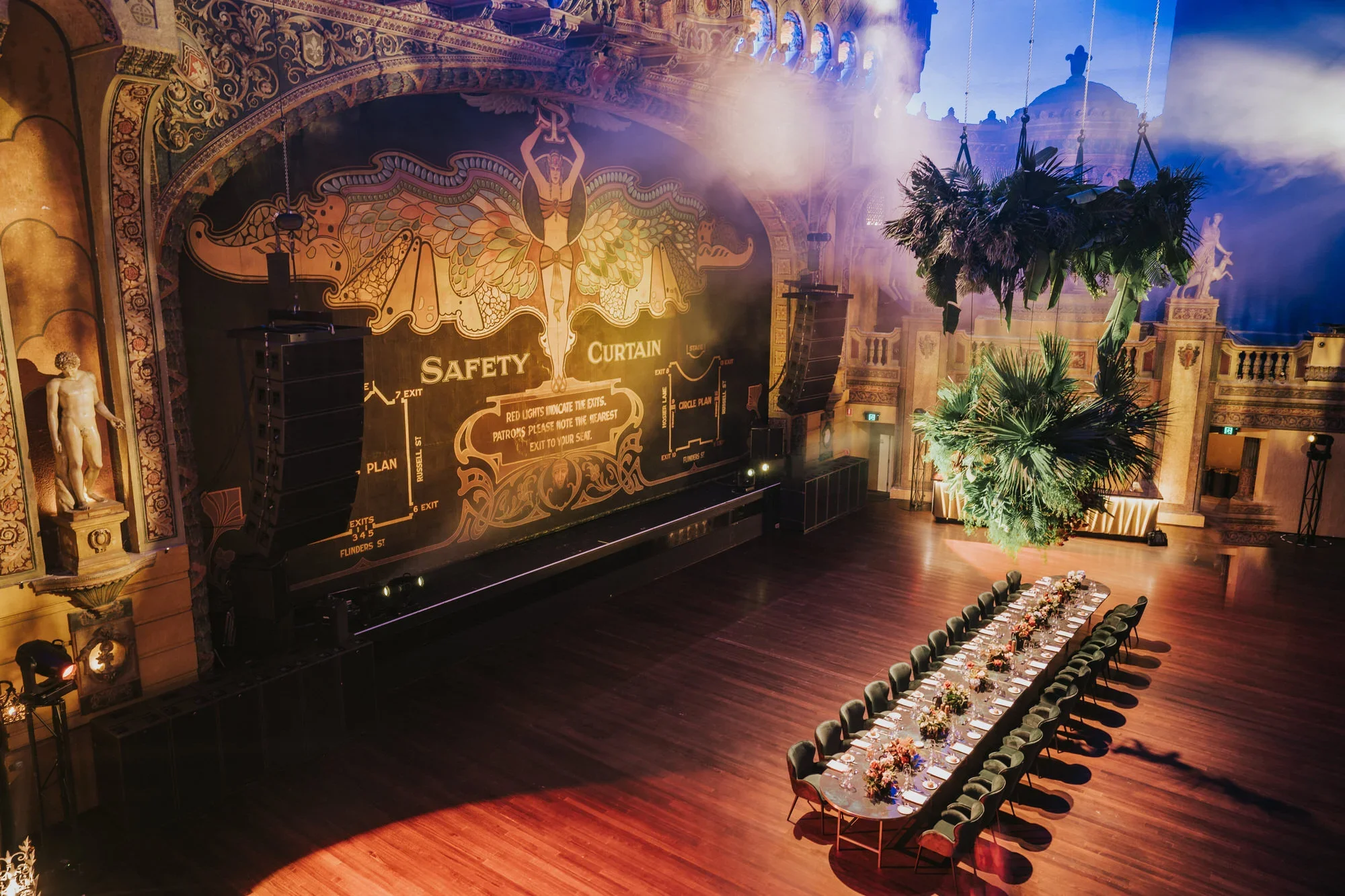 Sydney corporate event photography: Formal long dining table setup inside an ornate historic theatre.